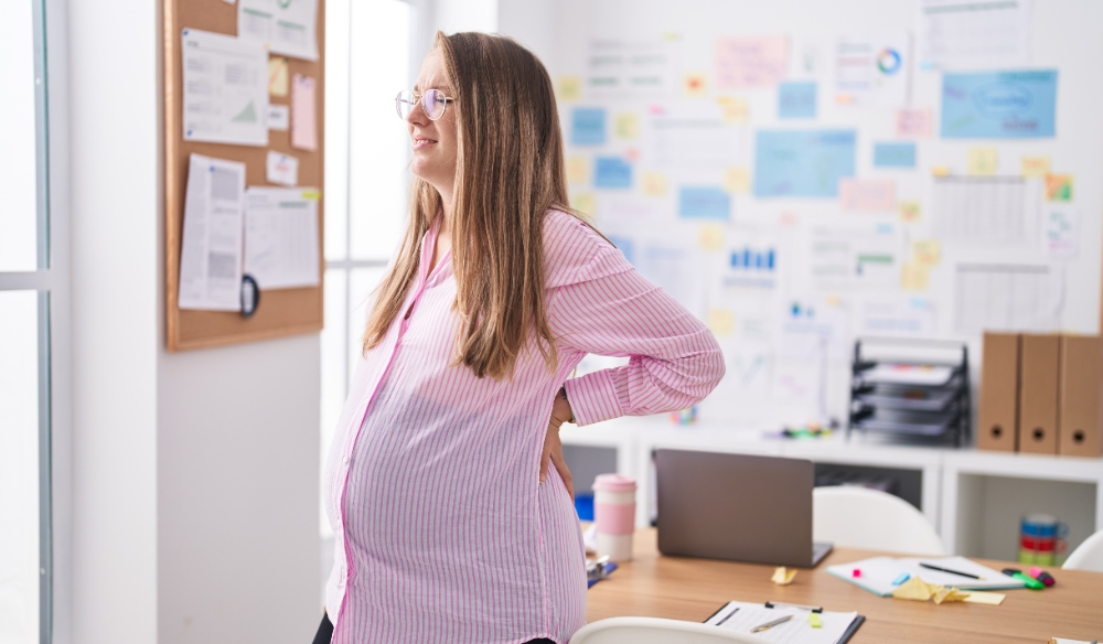 pregnant millennial at work