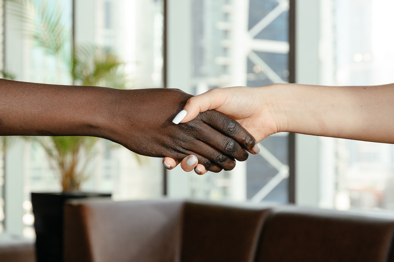 women shaking hands