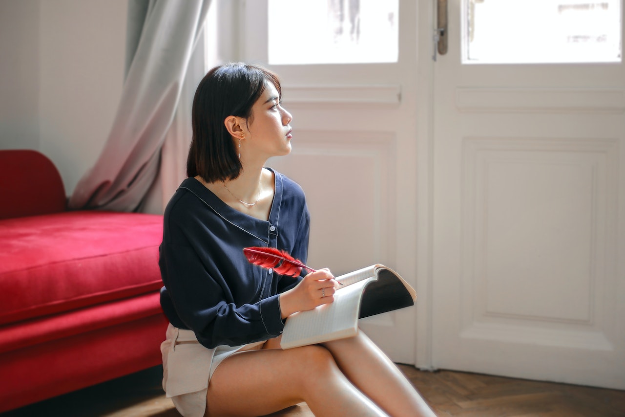 woman writing in a journal