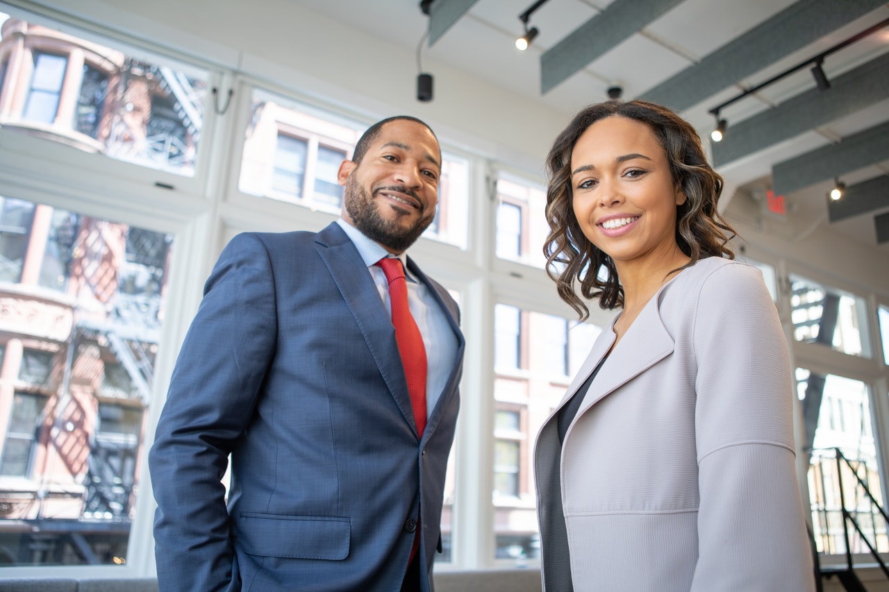 man and woman in office