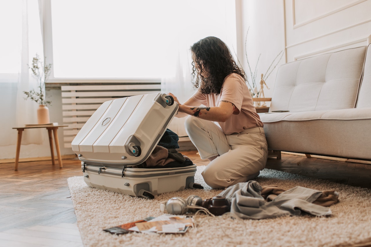 woman packing suitcase