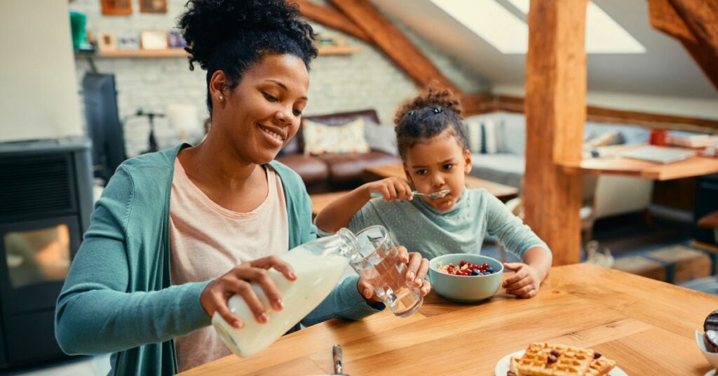 mom and daughter enjoying breakfast at home