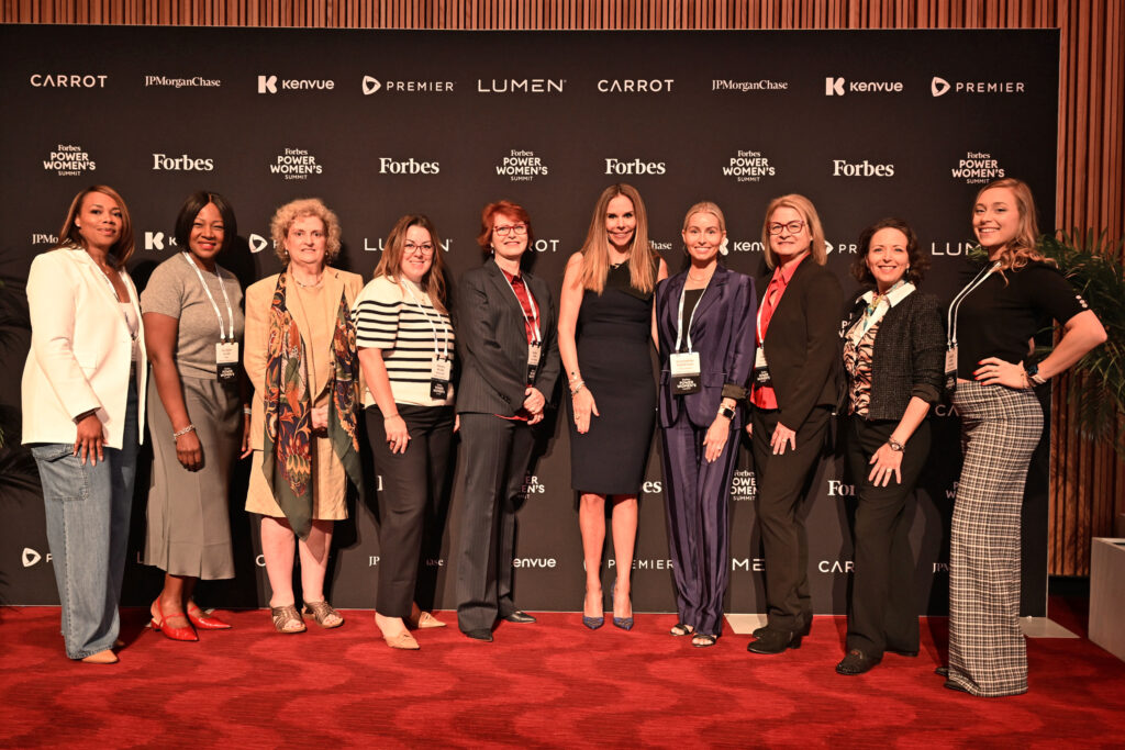 Forbes EVP Moira Forbes posing with guest attendees