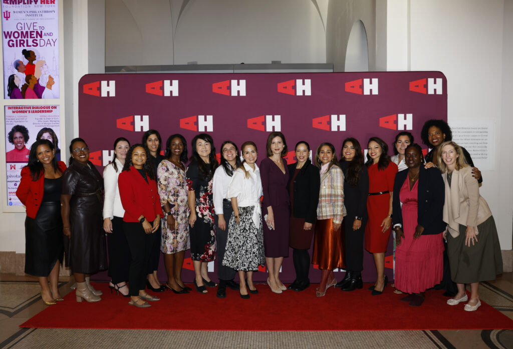 Amplify Her Founder, Marti Speranza Wong, posing with event attendees