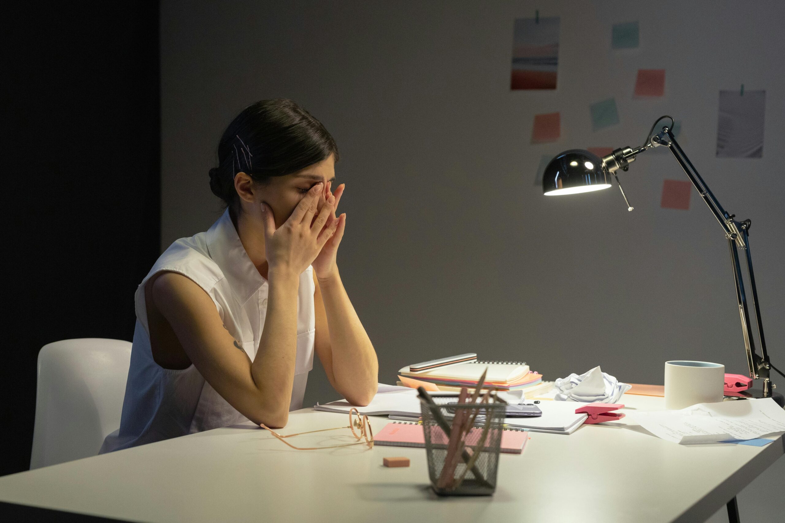 Woman stressed at work, experiencing seasonal affective disorder