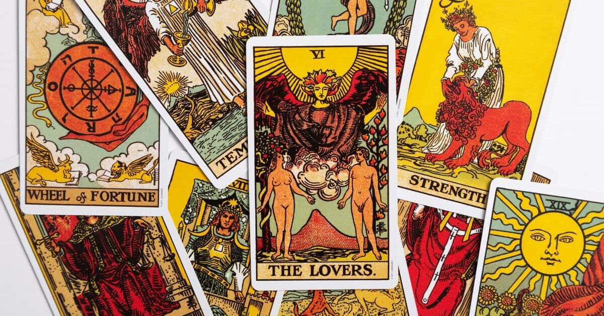 Tarot spread featuring the 'lovers' card with white background