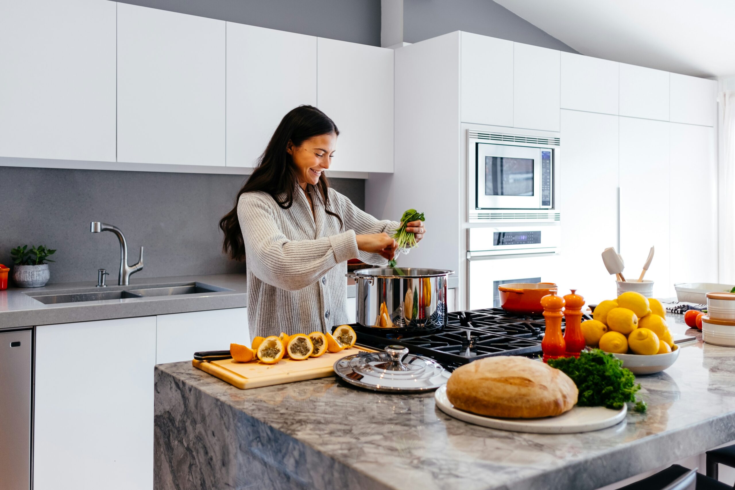 Woman prepares helahty meal in her kitchen at home