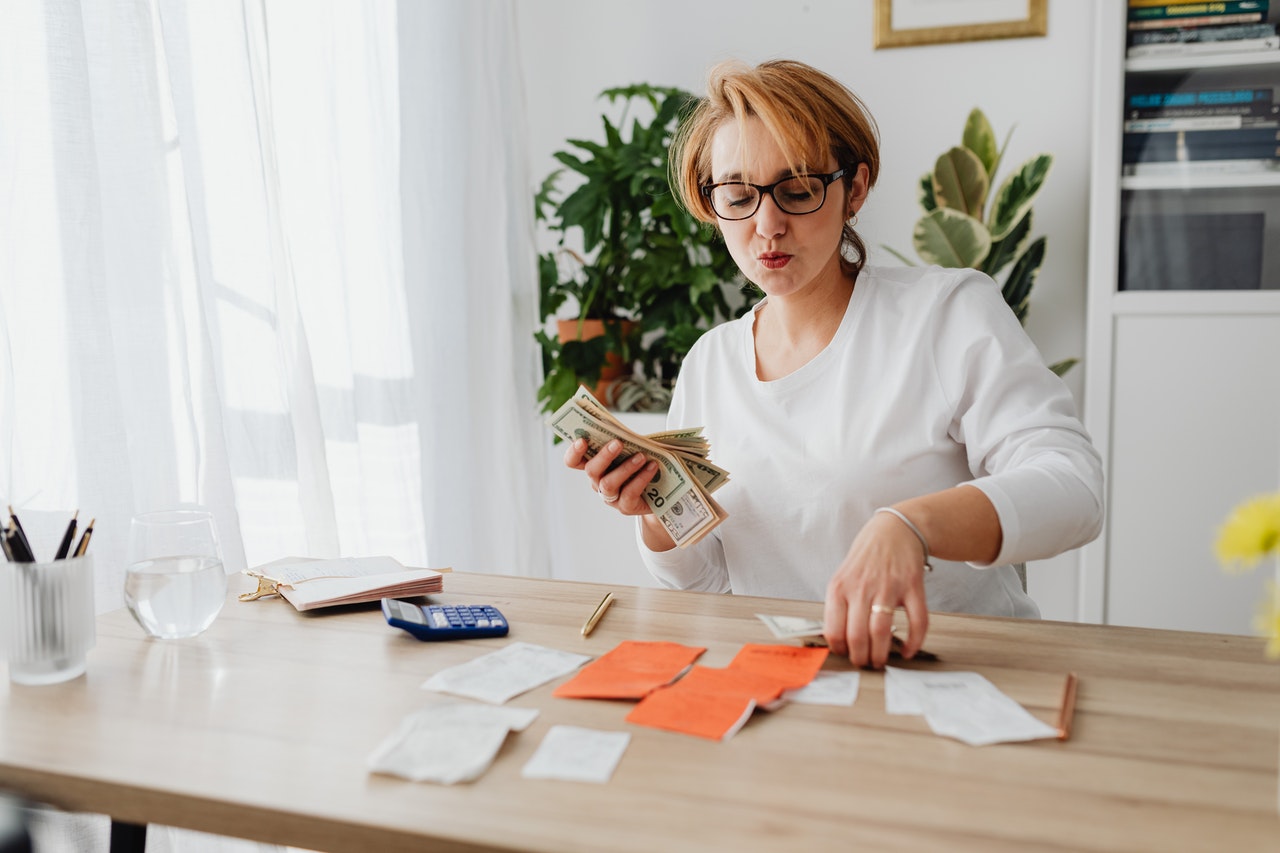 woman holding cash