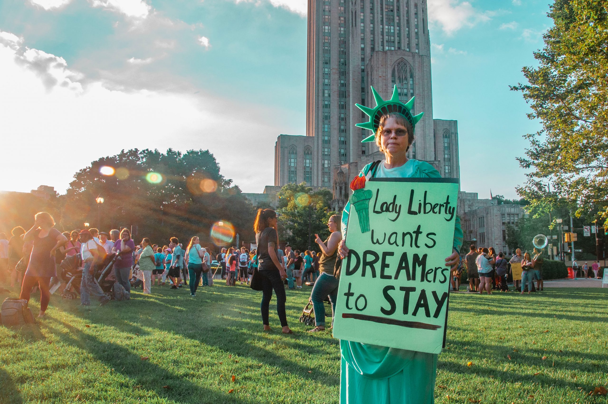 women holding pro-immigration sign