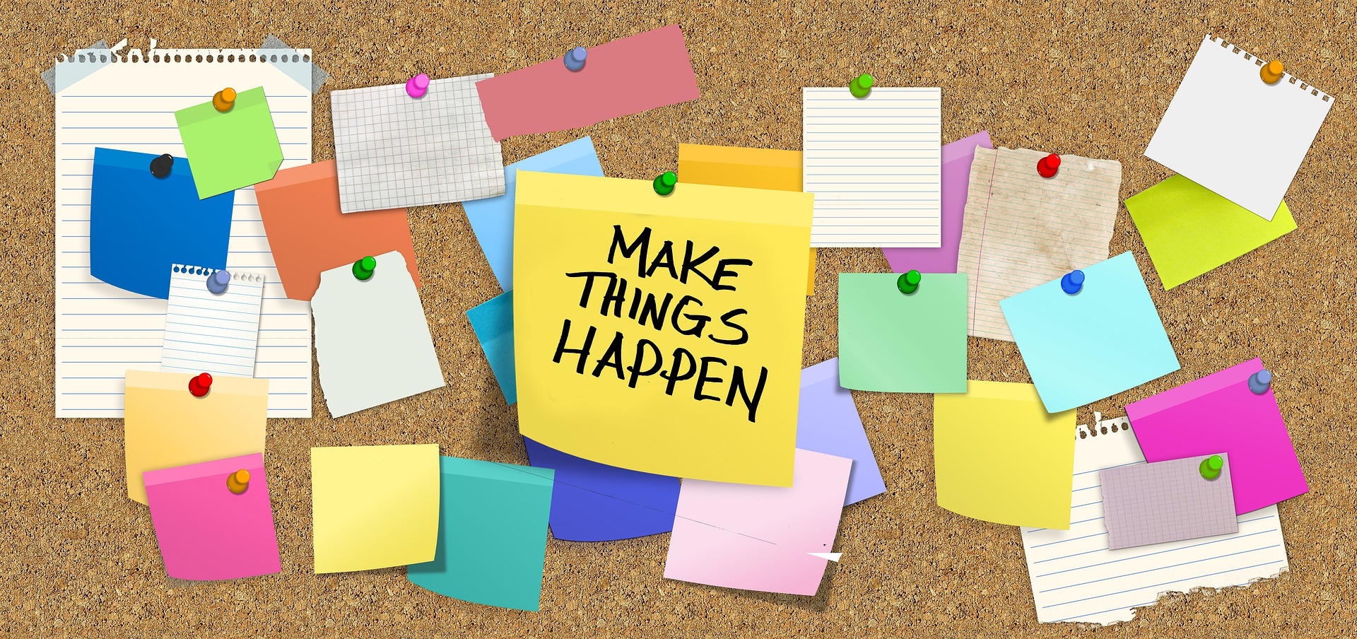bulletin board covered in sticky notes, including one center reading: Make Things Happen